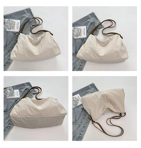 Detail shots of large nylon tote bag showing textured fabric and brown straps