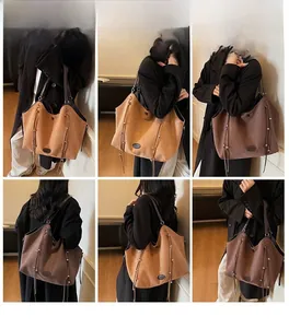 Detailansicht der großen Wildleder-Tote-Bag mit Fransen und Nieten in Braun und Kaffee