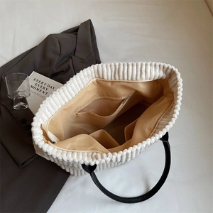Beige corduroy tote bag with large capacity, contrast black handles and internal pockets