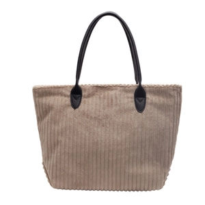 Large brown corduroy tote bag with black leather handles for women's daily commute