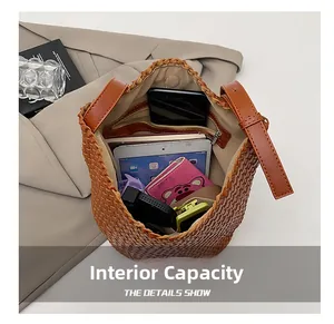 Top view of woven bucket bag interior showing spacious capacity and zipper pocket