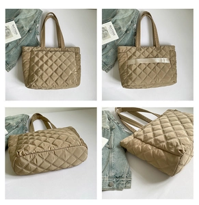Macro detail of khaki quilted tote bag with diamond stitching and luggage trolley strap