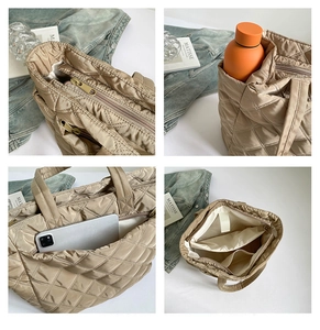 Detailed interior of khaki quilted tote bag showing dual zipper and spacious compartments