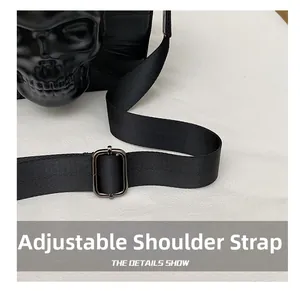 Detail of adjustable textile shoulder strap and metal buckle on Gothic skull bag