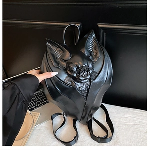 Close-up of black 3D gothic bat backpack with detailed wing texture and synthetic leather