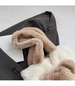 Detail of soft faux rabbit fur plush tote bag with wide comfortable shoulder strap