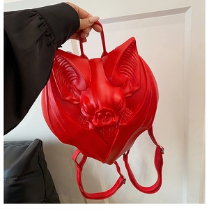 Detailed view of the red gothic bat backpack with sculpted face and 3D fangs