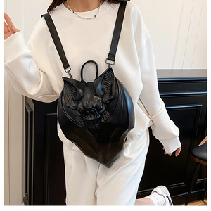 Detailed view of 3D bat backpack featuring embossed gothic design and PU leather texture