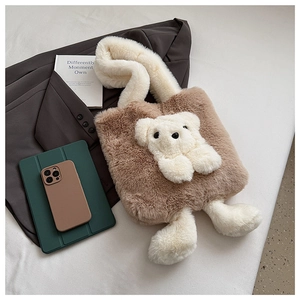 Detail of cute plush teddy bear tote bag with 3D doll ornament and soft white handle