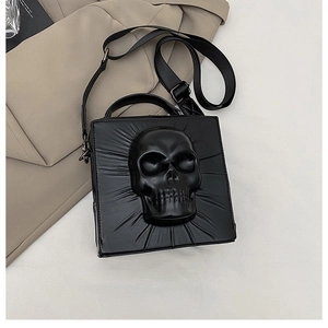 Macro view of 3D skull relief on black punk PU leather crossbody bag with radial texture