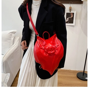 Detailed view of red bat-shaped Gothic punk bag with 3D embossed texture and adjustable strap