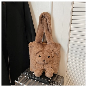 Detail of a brown plush tote bag featuring a cute 3D teddy bear design and soft faux fur