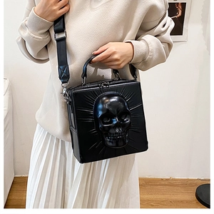 Gothic skull crossbody bag with 3D embossed skeleton design and silver hardware