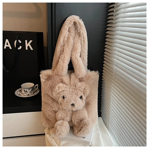 Close-up of beige plush tote bag featuring a cute 3D teddy bear and soft faux fur texture
