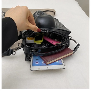 Internal view of Gothic skull bag showing multi-layer space for tablet and makeup