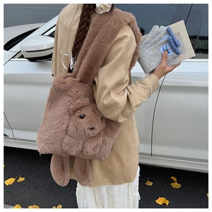 Brown plush bunny shoulder bag street style view showing soft fur texture and rabbit shape