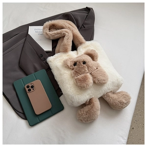 Detail of plush tote bag featuring a 3D teddy bear design and soft faux fur texture