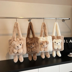 Plush teddy bear tote bags in four neutral colors hanging on a metal rack display