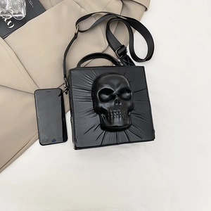 Gothic punk crossbody bag featuring 3D skull relief with adjustable wide strap