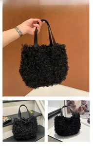 Detail view of large fluffy black tote bag featuring textured faux fur and leather straps