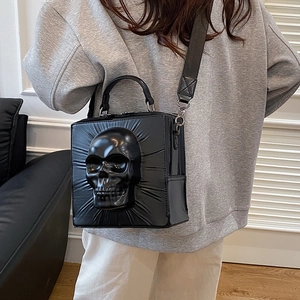 Gothic black skull relief crossbody bag with wide strap and 3D punk design for women