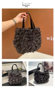 Detail of gunmetal grey faux fur tote bag with black handles and fluffy texture