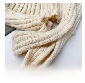 Close-up of comfortable cream white rib-knitted shoulder strap with soft texture