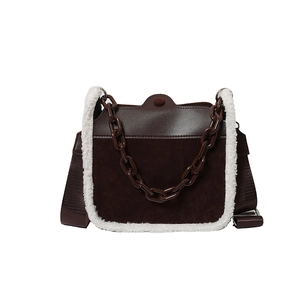 Vintage brown suede shoulder bag with white faux shearling trim and acrylic chain