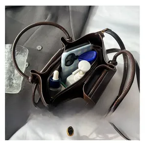 Top view of the brown leather bucket bag showing its spacious interior for daily essentials