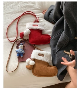 Detail of Christmas stocking plush crossbody bags with soft faux suede and furry trim