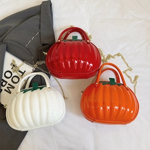 Unique pumpkin-shaped leather crossbody handbag with chain strap in red, white and orange