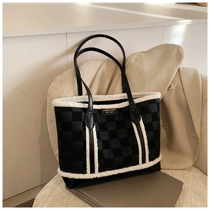 Detail of winter tote bag featuring black floral fabric and white plush fleece trim