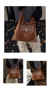 Detail of embroidered bohemian tote bag with vintage patterns on brown faux suede fabric