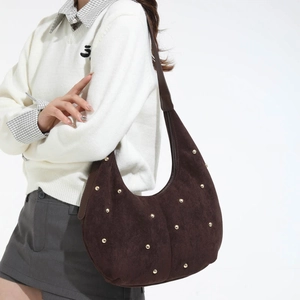 Dark brown suede hobo bag with gold stud embellishments and crescent moon shape