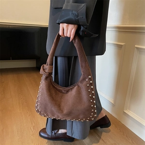 Chocolate brown suede hobo bag with silver rivets and knotted shoulder strap detail