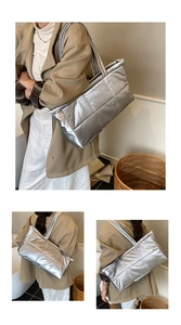 Quilted silver down tote bag showing large capacity structure and metallic fabric detail