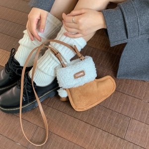 Plush boot-shaped crossbody bag in brown suede and faux shearling with leather strap