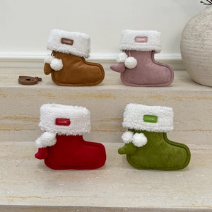 Mini plush Christmas stocking crossbody bags in brown, pink, red, and green colors