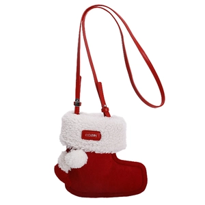 Christmas boot-shaped crossbody bag in red suede and white faux fur with pompom detail