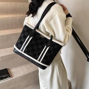 Winter plush拼接 tote bag in black with white faux fur trim and textured floral patterns