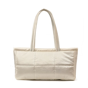 Chic champagne quilted puffer tote bag with metallic finish and spacious shoulder design