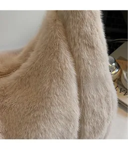 Close-up of fluffy faux fur texture on a beige tote bag with soft tactile details