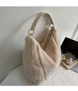 Close-up of fluffy faux fur tote bag showing soft texture and gold metal ring detail