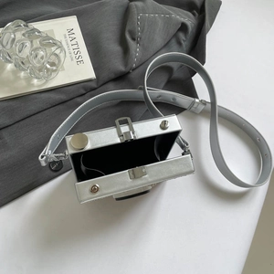 Silver vintage camera-shaped crossbody box bag with metallic finish and leather strap