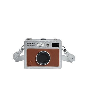 Retro camera-shaped silver crossbody bag with brown leather panel and adjustable strap