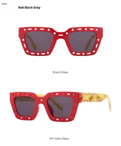 Detail view of red镂空sunglasses with dark gray lenses and tortoiseshell temples