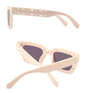 Detail view of beige square sunglasses featuring unique hollow-out frame design side and back
