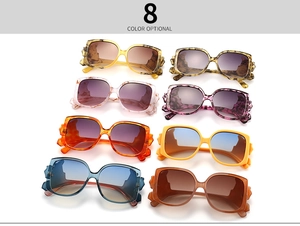 Flat lay of square cat-eye sunglasses in eight different gradient lens and frame colors