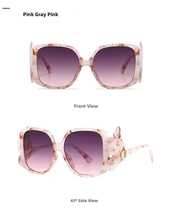 Detail of pink marble frame sunglasses with gradient lenses and wavy temple design
