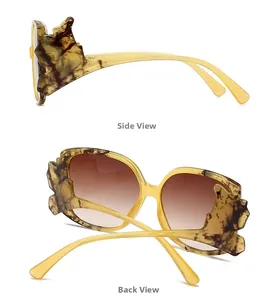 Detail view of tortoiseshell sunglasses featuring unique wing-shaped temple structures